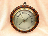Late 19th century marine barometer in ropetwist dark oak body